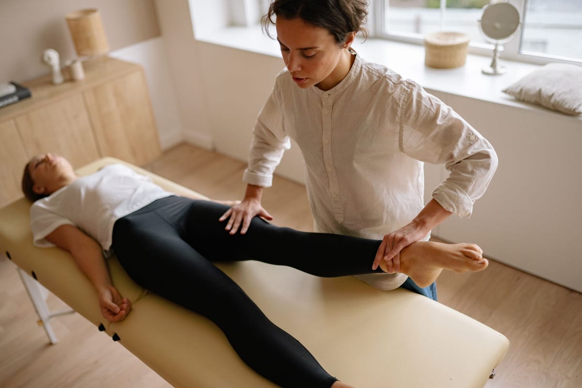 A straight-leg-raise assessment on a treatment table