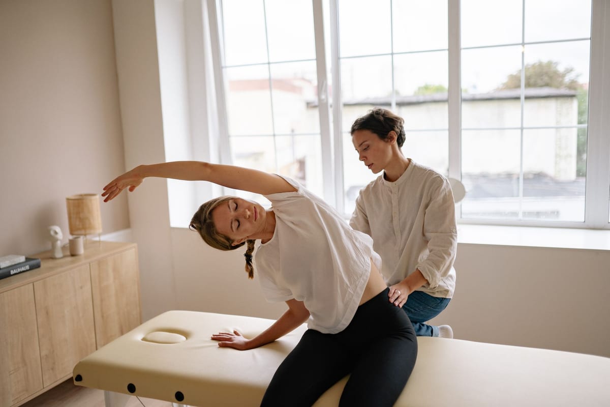 A chiropractor performing a supported spinal treatment